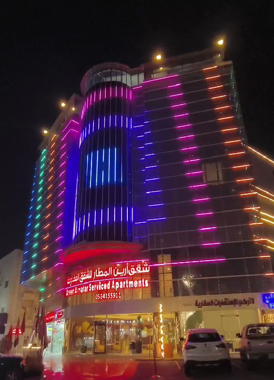 A beautifully illuminated modern building facade at night